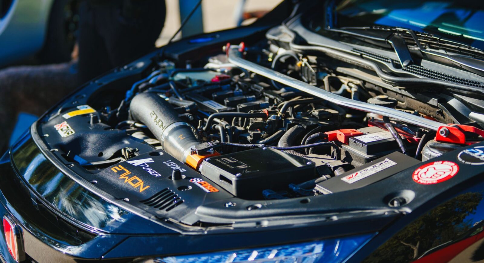 automotive glow plug control module mounted on engine bay