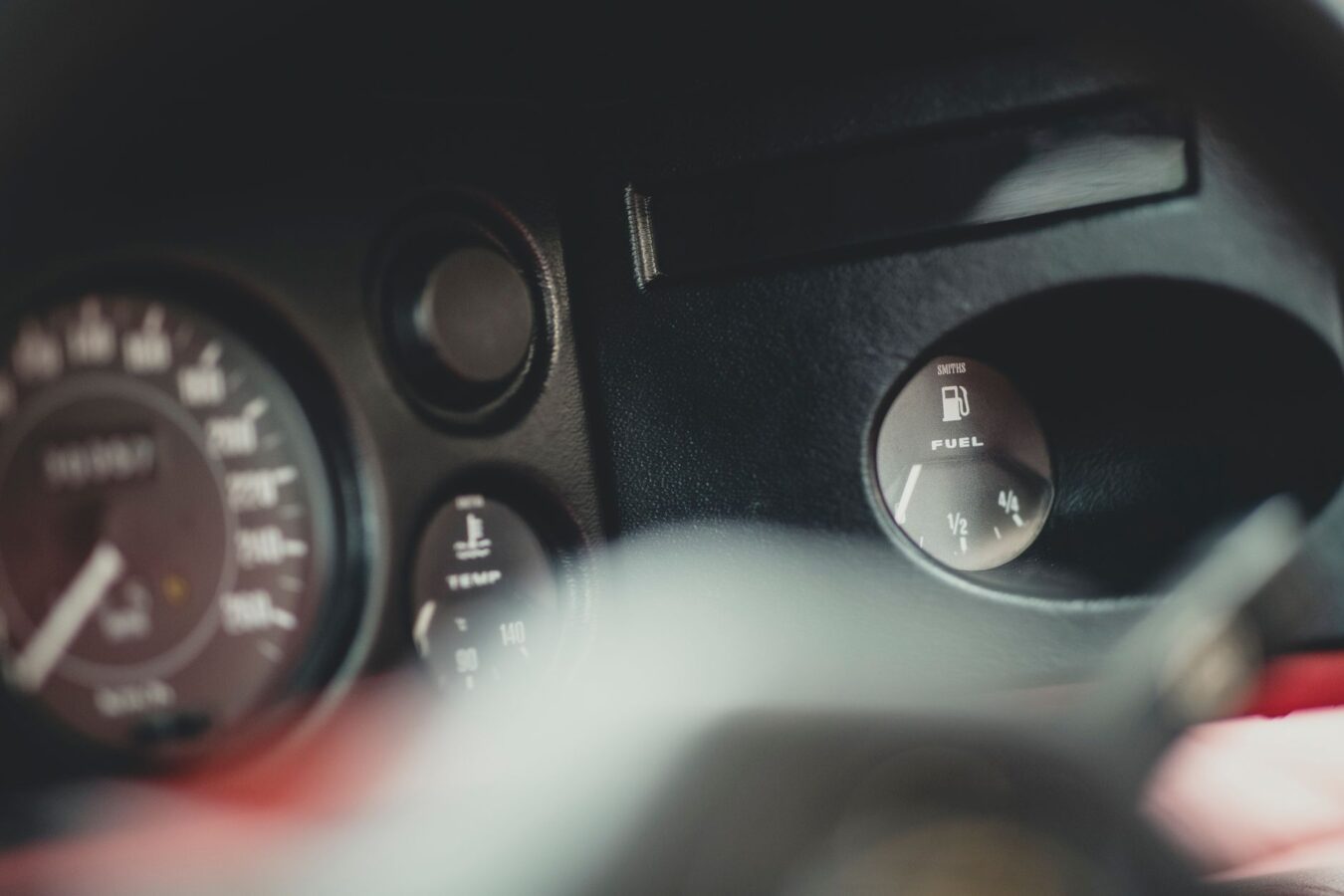 close-up of fuel gauge needle on dashboard