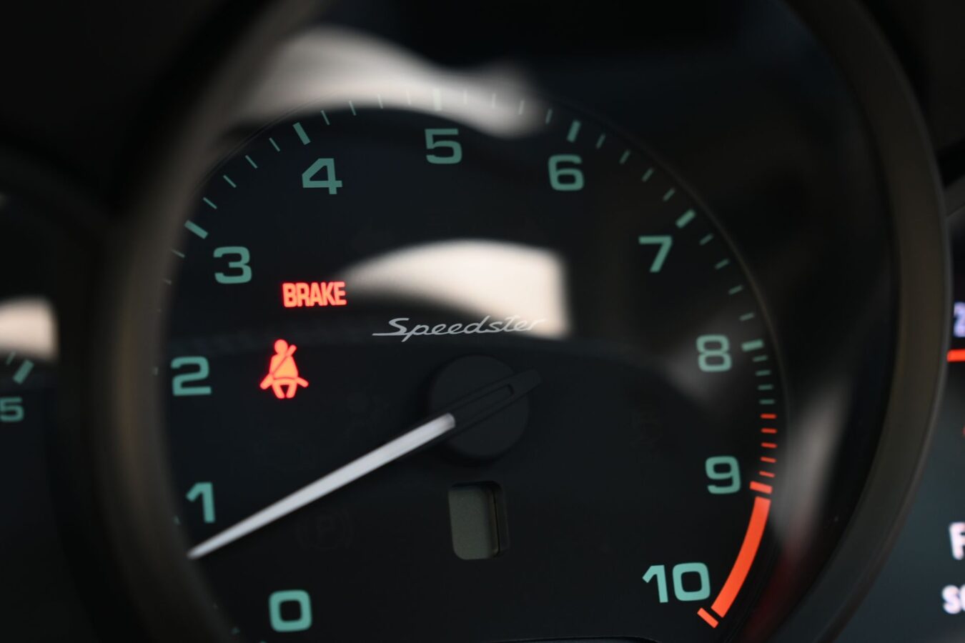 car engine warning light on dashboard closeup