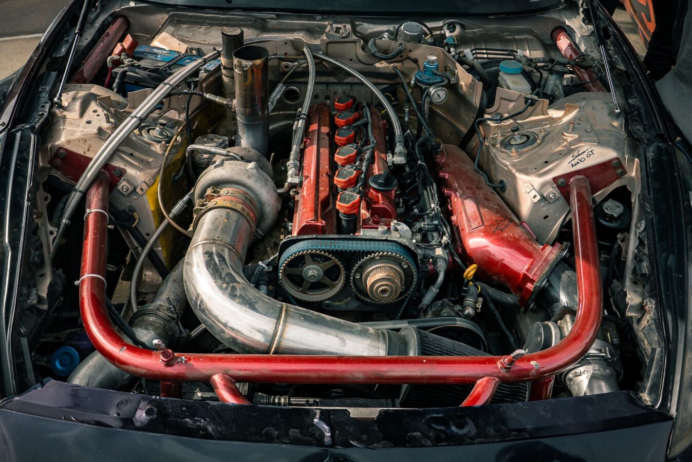 mechanic testing intake manifold vacuum leak with smoke machine