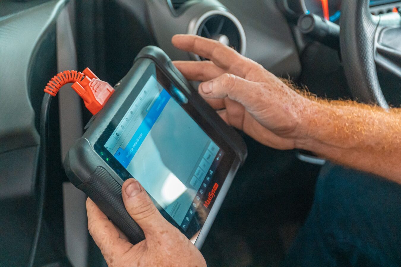 OBD2 scanner diagnostic tool connected to port