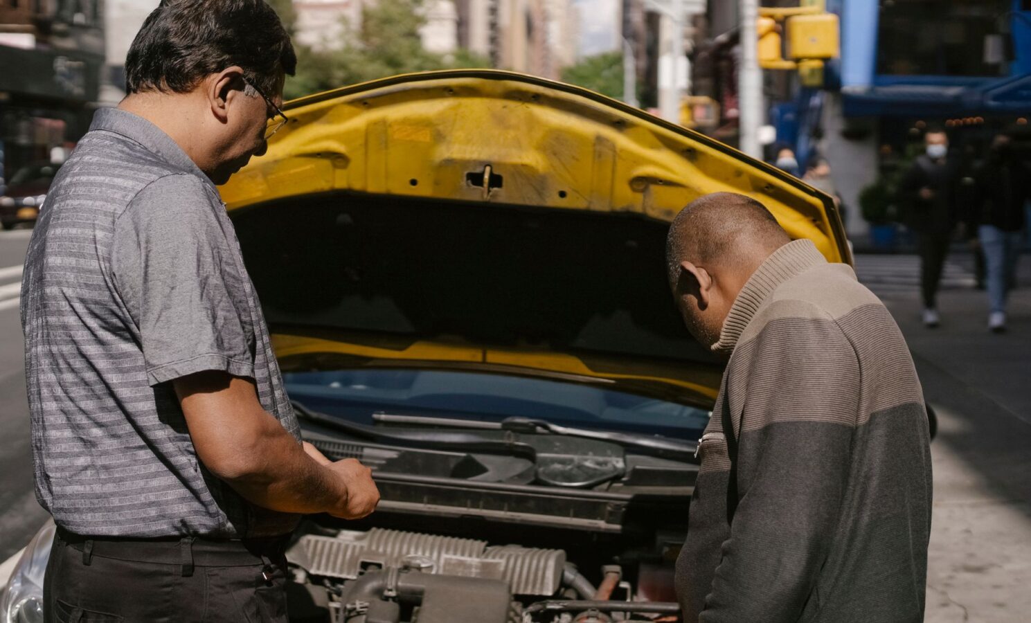 car mechanic checking diagnostic trouble codes