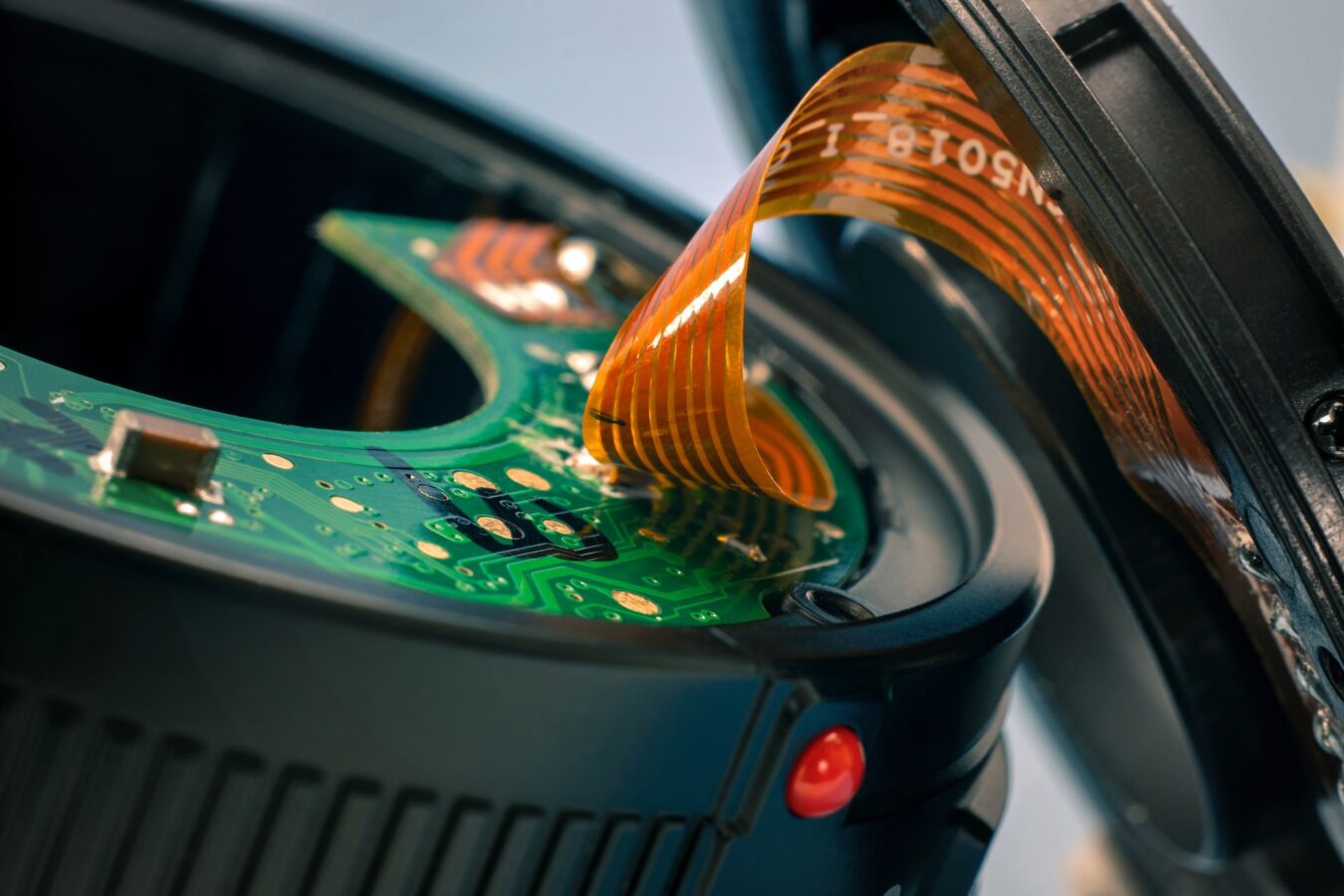 exploded view of car rear view camera showing lens, housing and circuit board